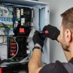 Man Fixing the System