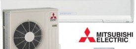 Mitsubishi Electric outdoor compressor unit connected to white indoor wall-mounted air handler with red diamond logo.